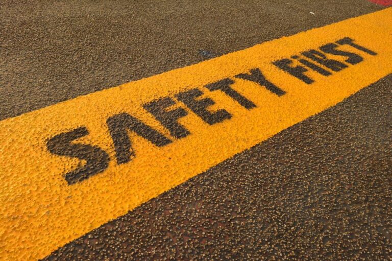 Safety first sign painted on pavement