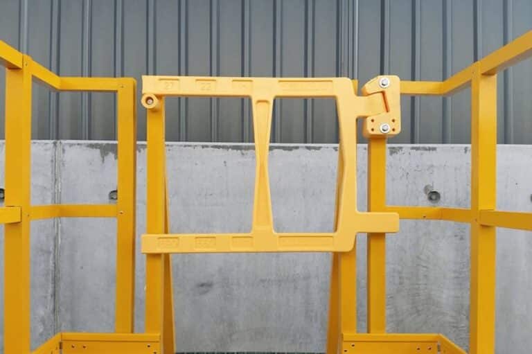 A large yellow safety gate installed to ensure workplace safety.